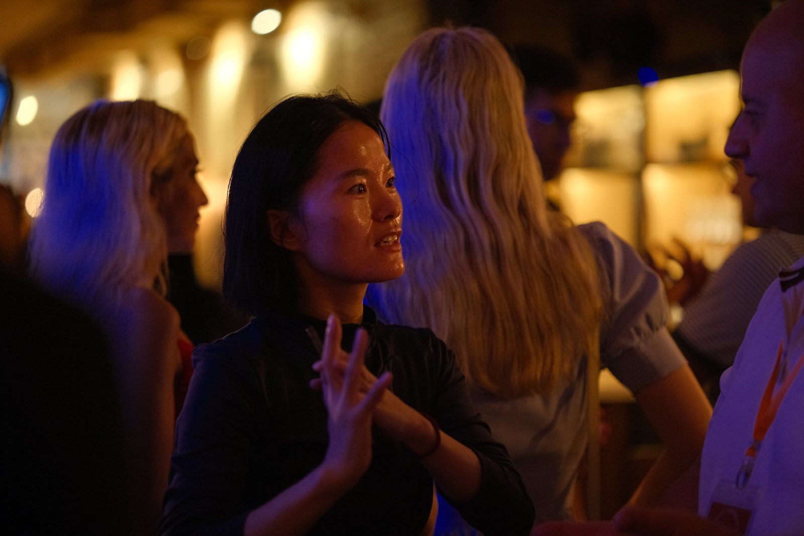 Guests in conversation at the bar