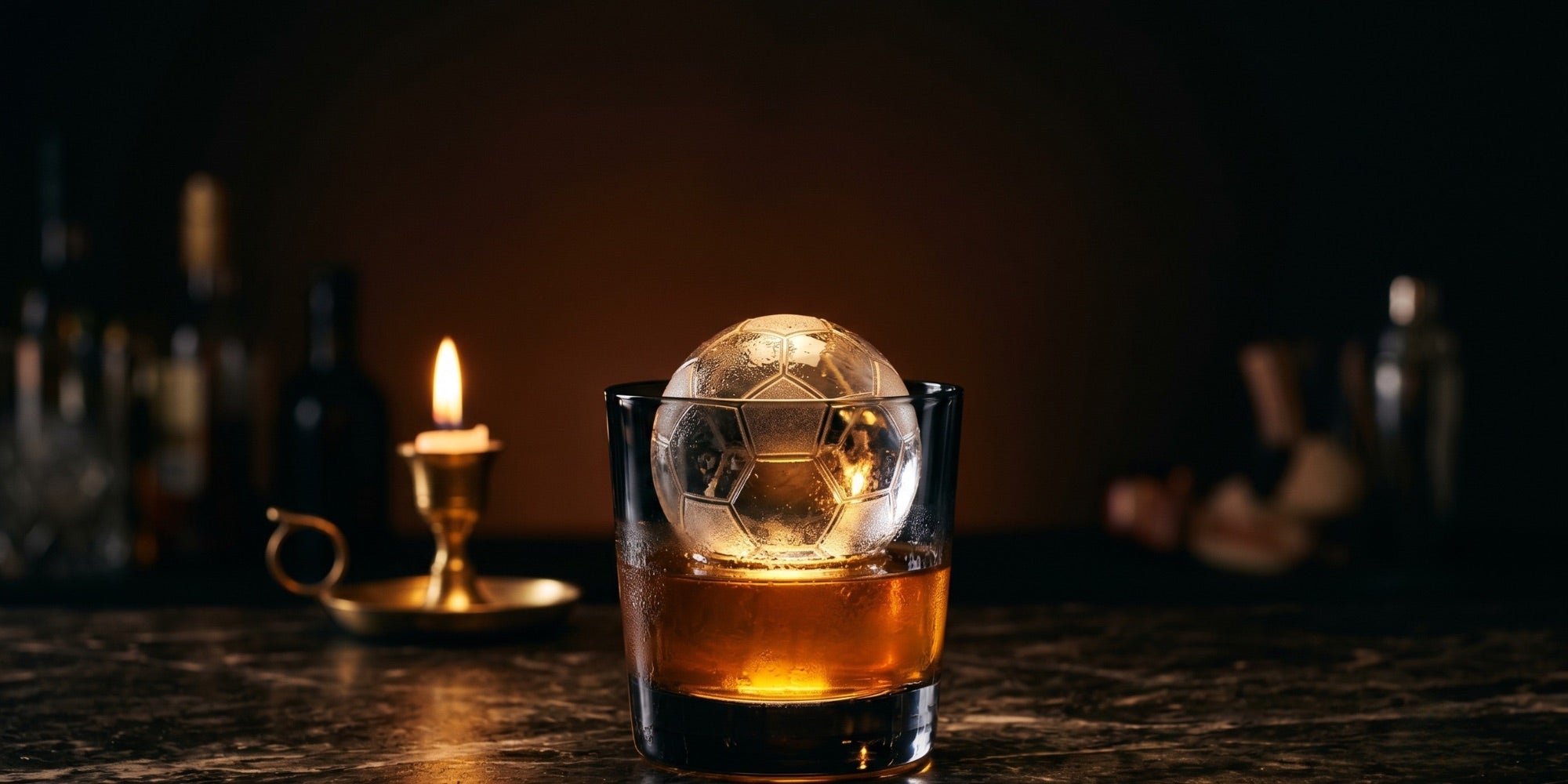 Alcohol-free cocktail with a soccer-ball ice sphere at No More Cafe
